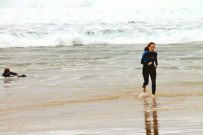 Woman standing on beach