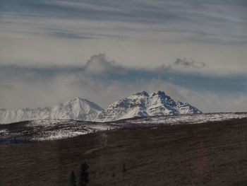 Scenic view of snowcapped mountain against sky