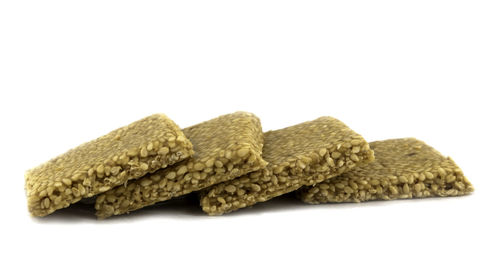 Close-up of carving on wood against white background