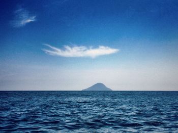 Scenic view of sea against blue sky