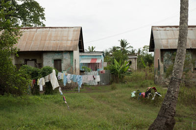 Rear view of people walking on field