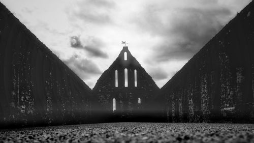 Low angle view of illuminated building against sky