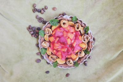 Directly above shot of dessert served in plate on textile