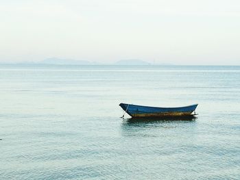 Boat in sea against clear sky