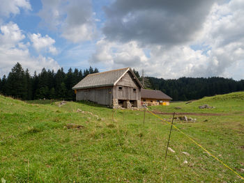 House on field against sky