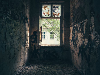 Window in abandoned damaged room