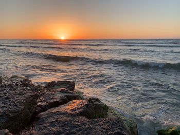 Scenic view of sea against sky during sunset