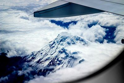 Scenic view of snow covered mountains against sky