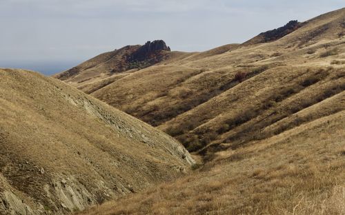 Scenic view of velour hills against sky