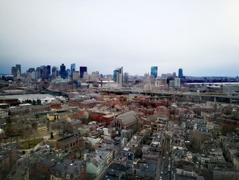High angle view of buildings in city against clear sky