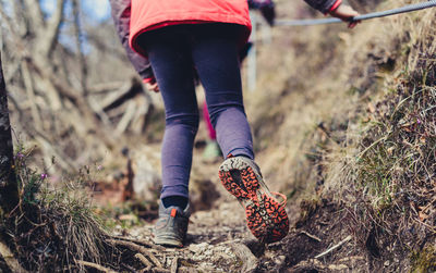 Low section of woman walking on land