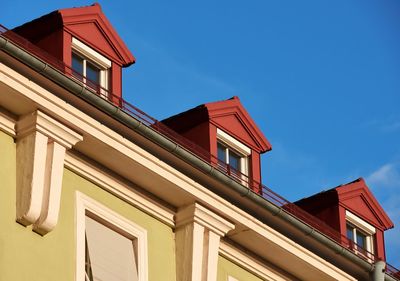 Low angle view of building against clear blue sky