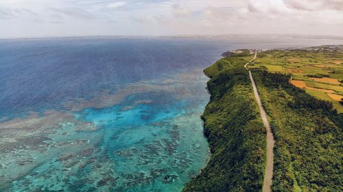 High angle view of sea shore against sky