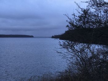 Scenic view of sea against sky at dusk