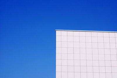 Low angle view of building against blue sky