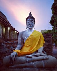 Statue of buddha against sky