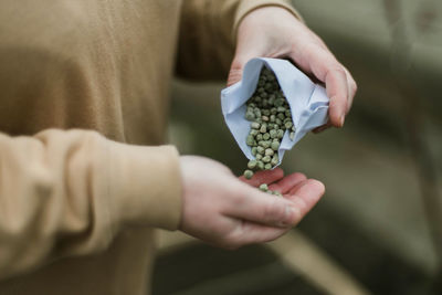 Cropped hand of person holding paper currency