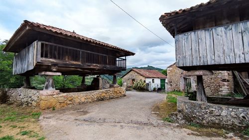 Old building by road in village