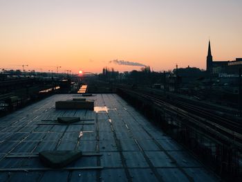 City against sky at sunset