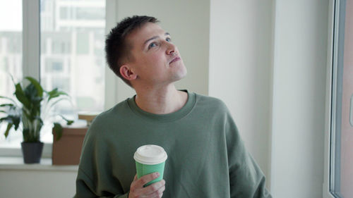 Portrait of young man looking away