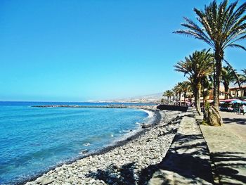 Scenic view of sea against clear blue sky