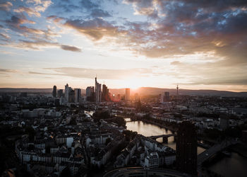 High angle view of city at sunset