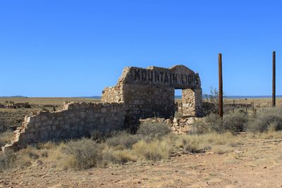 Low angle view of ruins against clear sky