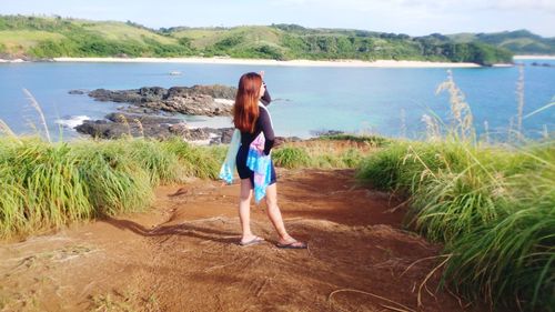 Woman standing on beach