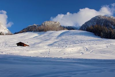 Scenic view of snow field against sky