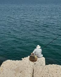 Man fishing in sea