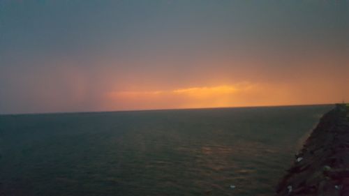 Scenic shot of calm sea at sunset