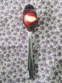 Close-up of red object on table