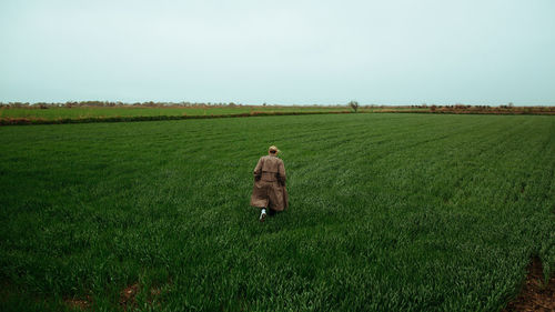 Rear view of woman walking on land