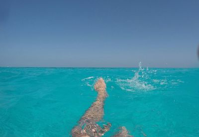 Panoramic view of sea against clear blue sky