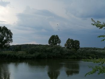 View of lake against cloudy sky