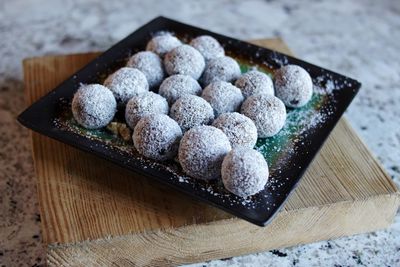 High angle view of cookies in container on table