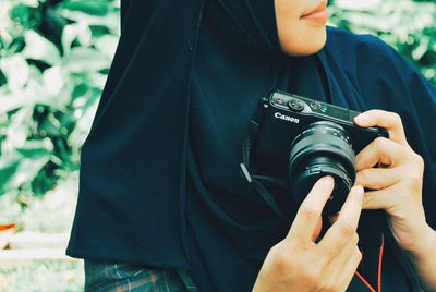 Midsection of man photographing