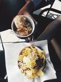 Cropped image of friends holding ice cream cups