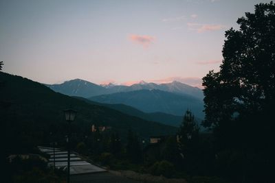 Scenic view of silhouette mountains against sky at sunset