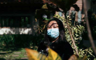 Portrait of young woman outdoors