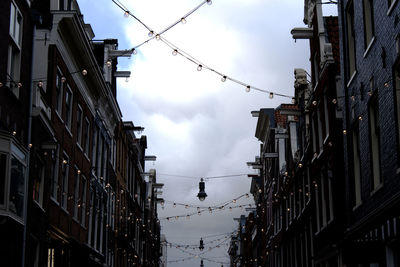 Christmas light decoration hanging on a street in amsterdam, the netherlands
