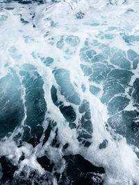 High angle view of surf on beach