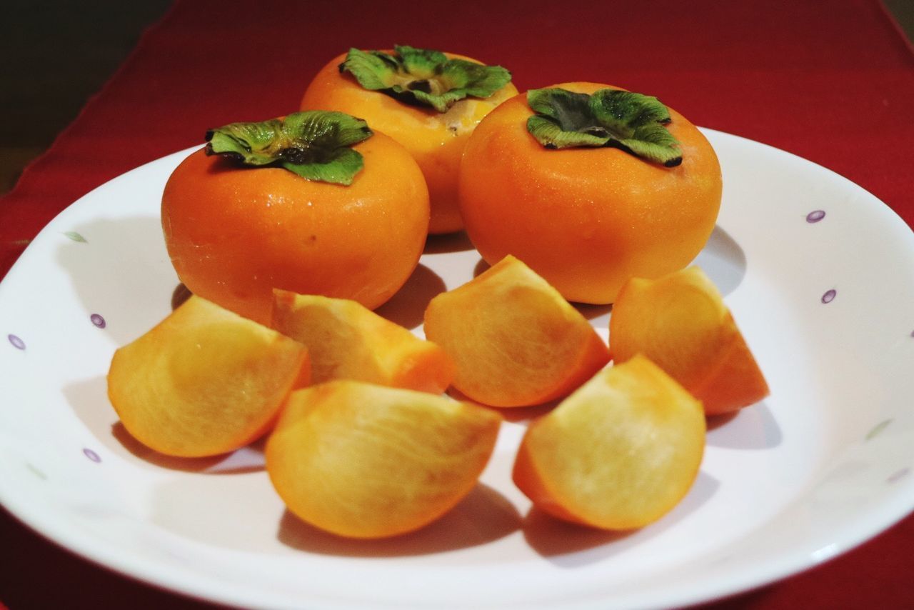 CLOSE-UP OF FRUITS ON PLATE