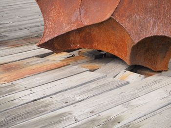 High angle view of fire hydrant on wooden floor