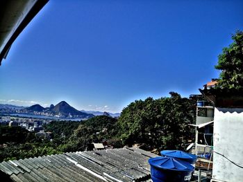 Scenic view of mountains against clear blue sky