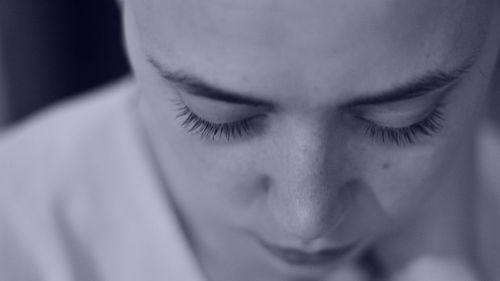 Close-up portrait of young man with eyes closed