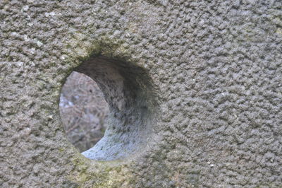 High angle view of hole on rock