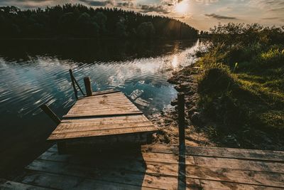 Pier over lake against sky