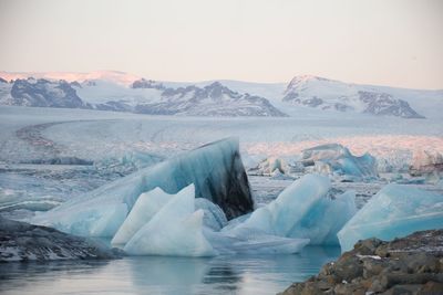 Scenic view of frozen lake against sky