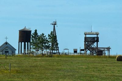 Built structure on field against sky